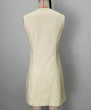 A Slim-Fitting Button-Down Sleeveless Short Skirt in the Style of a Socialite