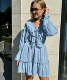Elegant V-Neck White Dress with Flared Sleeves and Ruffled Details