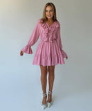 Elegant V-Neck White Dress with Flared Sleeves and Ruffled Details