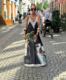 Relaxed Printed Vneck Strap Dress With Wide Skirt Style